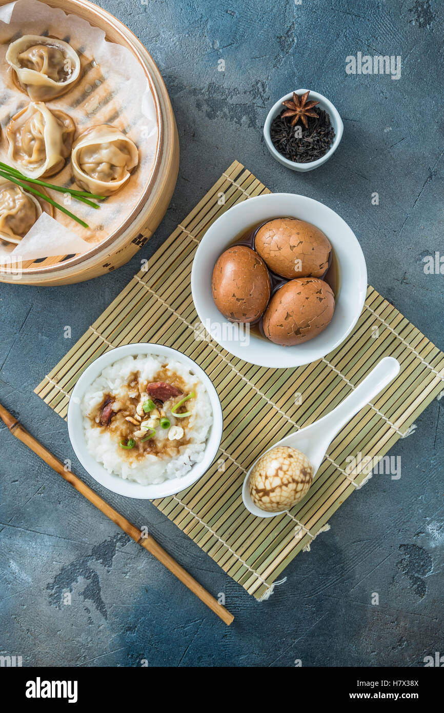Chinese Rice Breakfast Chinese breakfast with rice porrige, tea eggs and dim sum Stock Photo ...