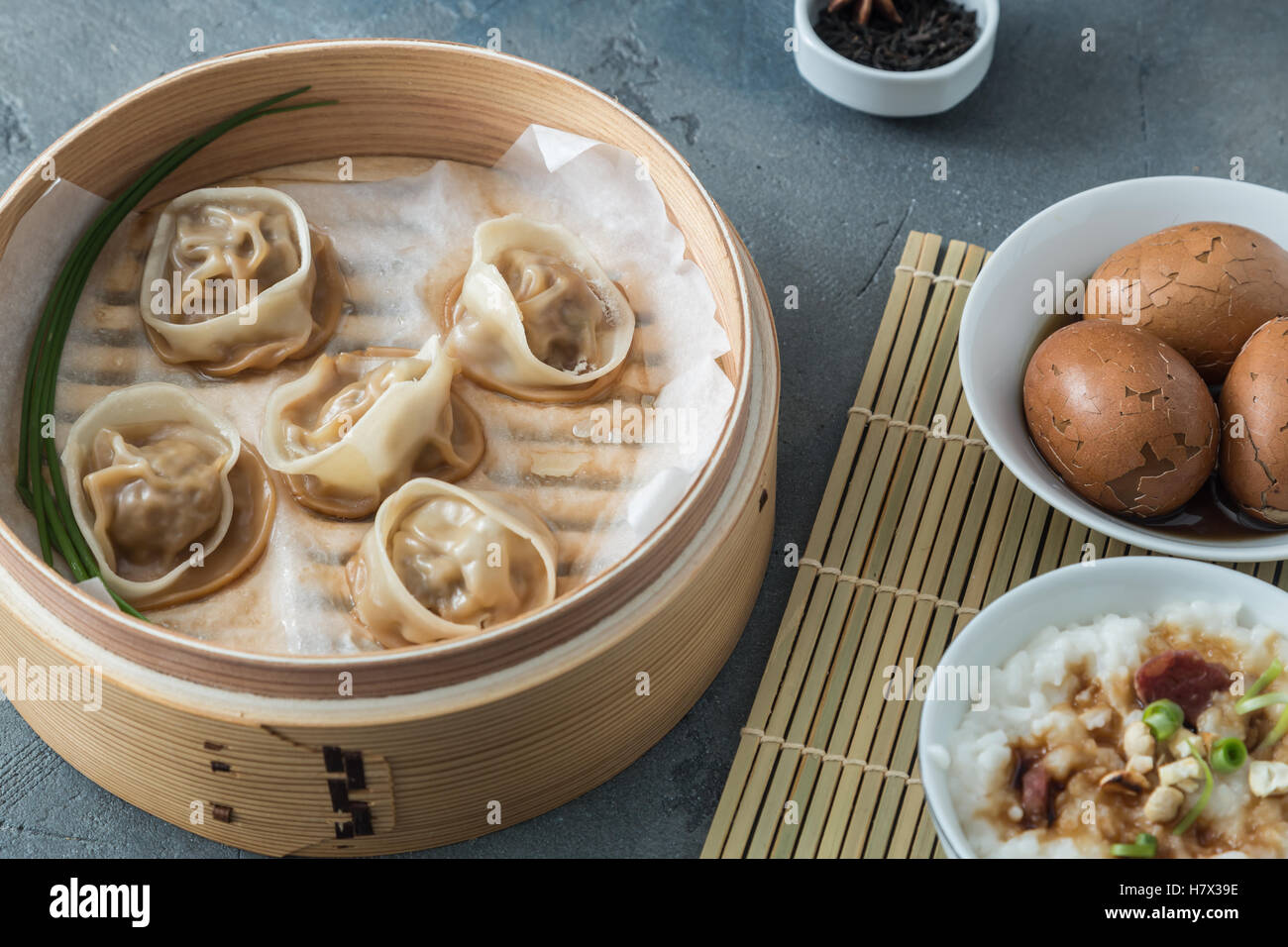 High angled view of cooked dumplings inside bamboo steamer with lip