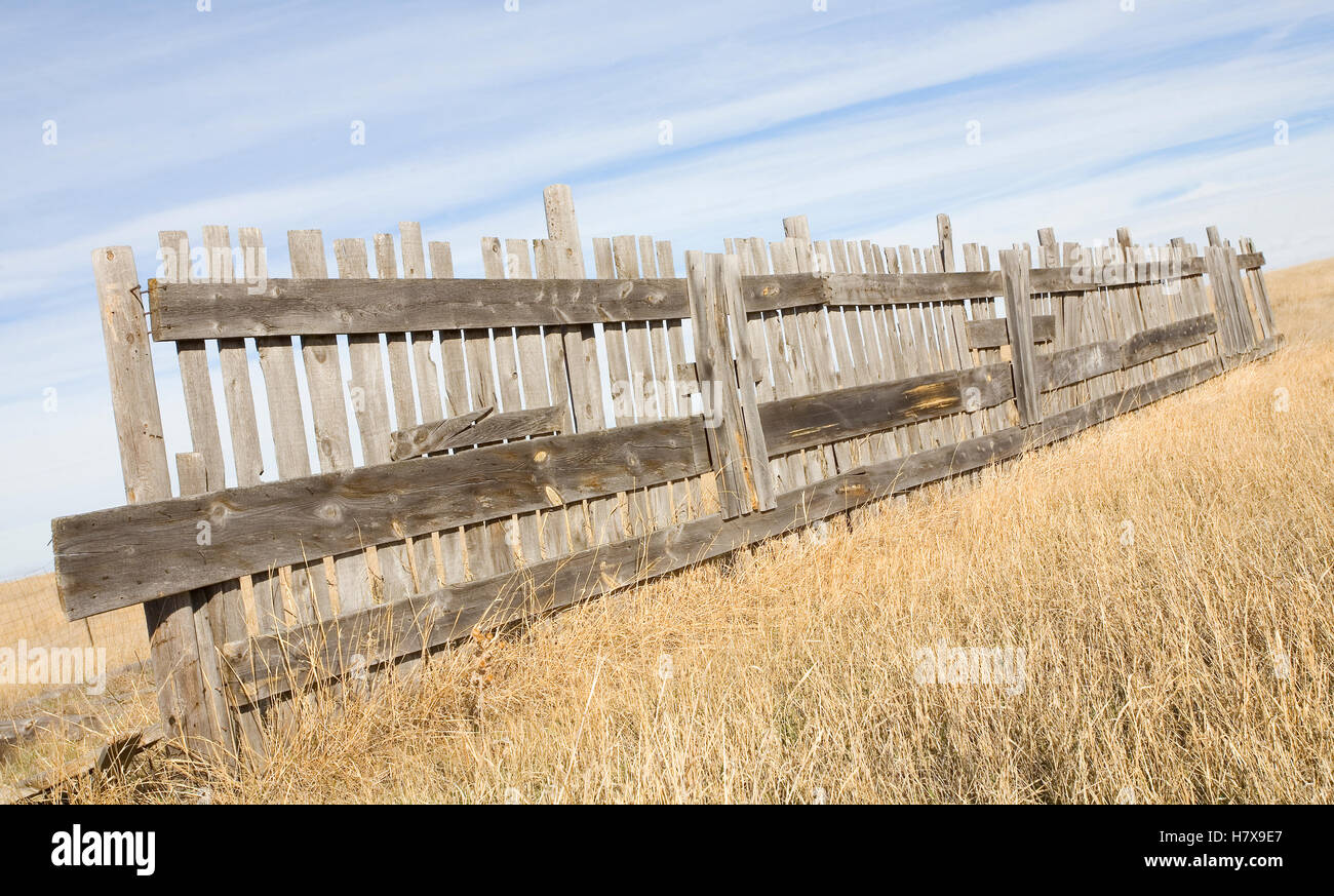 Wooden fence that is old in the middle of a grassy field Stock Photo ...