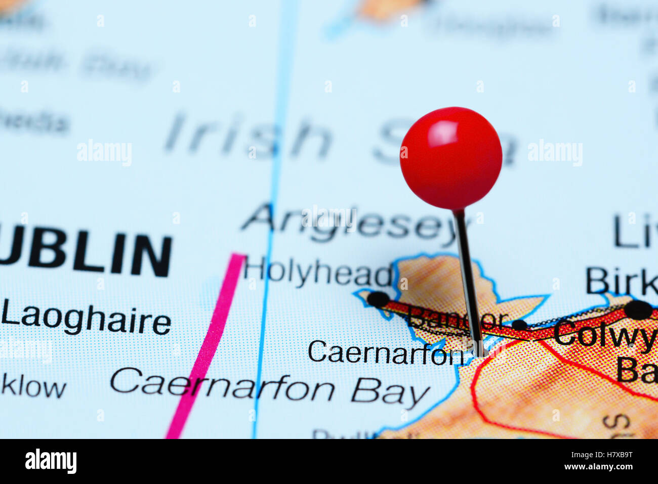 Caernarfon pinned on a map of Wales Stock Photo - Alamy
