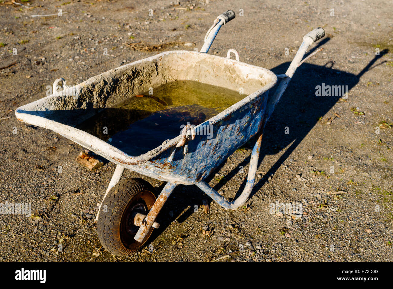 Industrial wheelbarrow with water and dry concrete Stock Photo Alamy