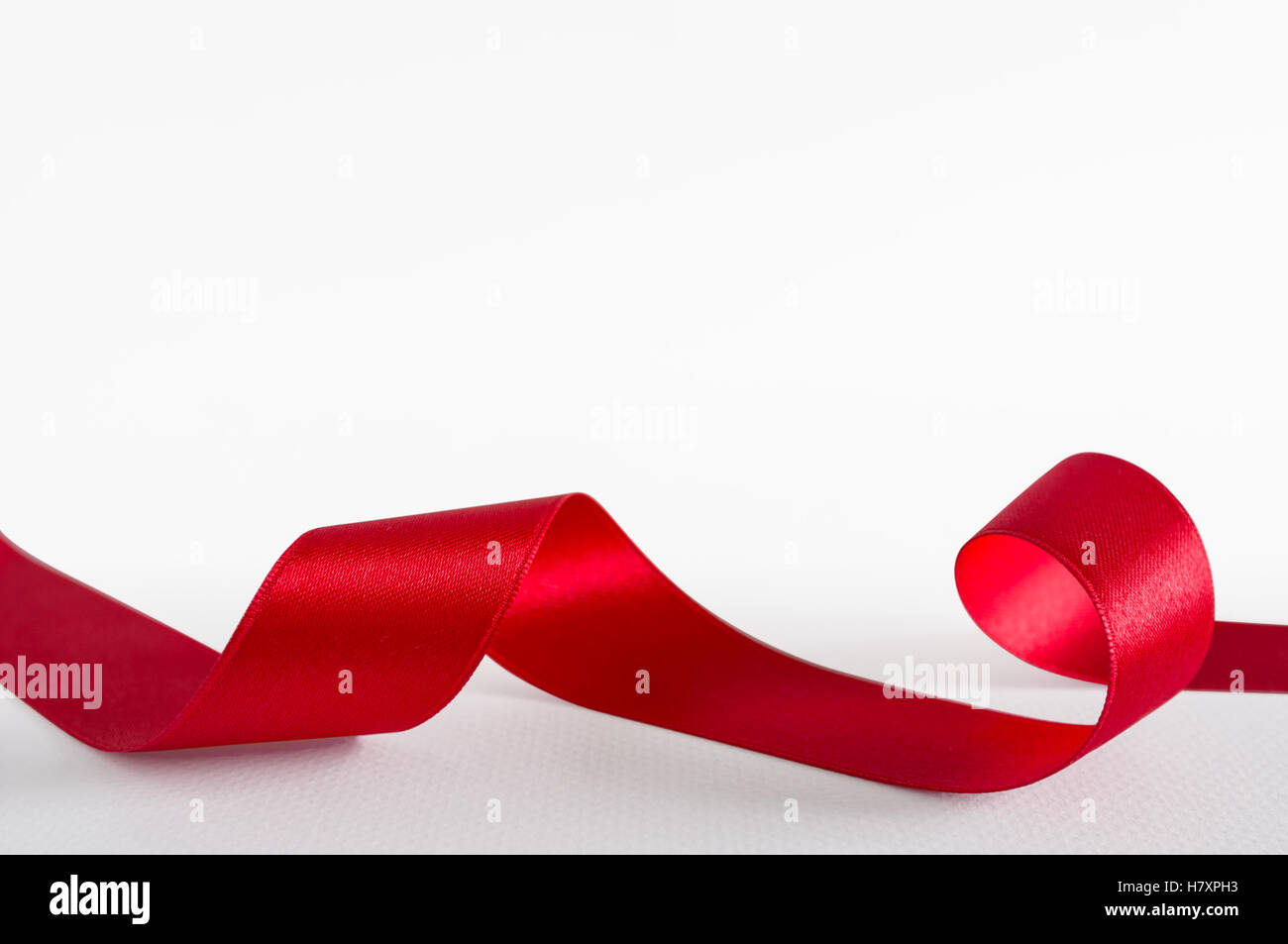 Red satin ribbon isolated on white background Stock Photo - Alamy