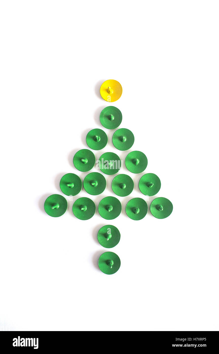 Green push pins. Thumbtacks christmas tree shape isolated on white