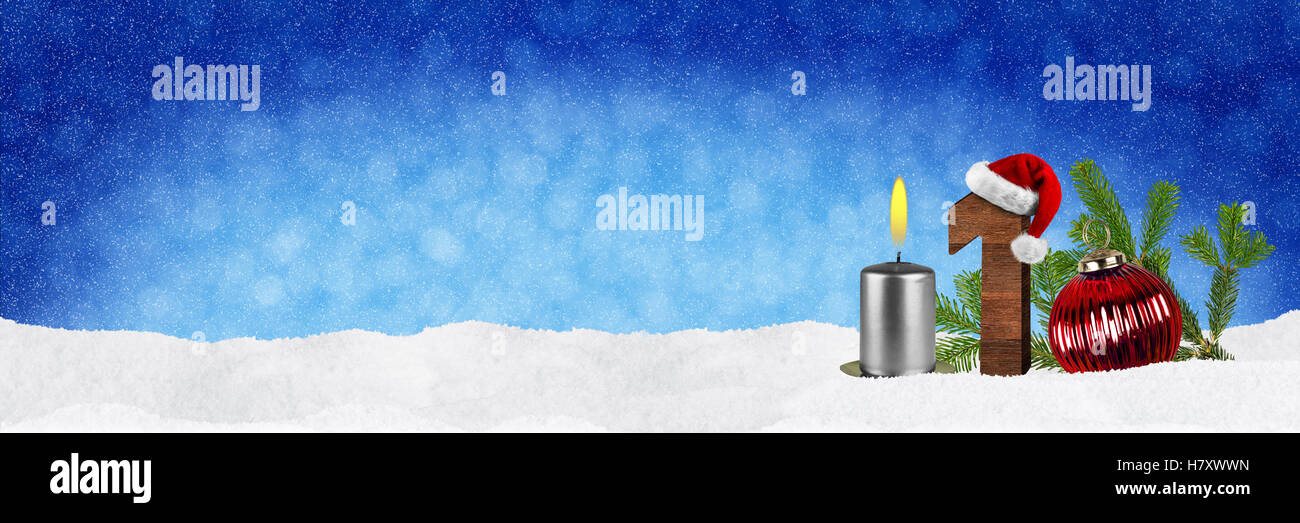 first sunday in advent conept xmas panorama blue background with candles ball bauble snow and red silver decorated fir branches Stock Photo