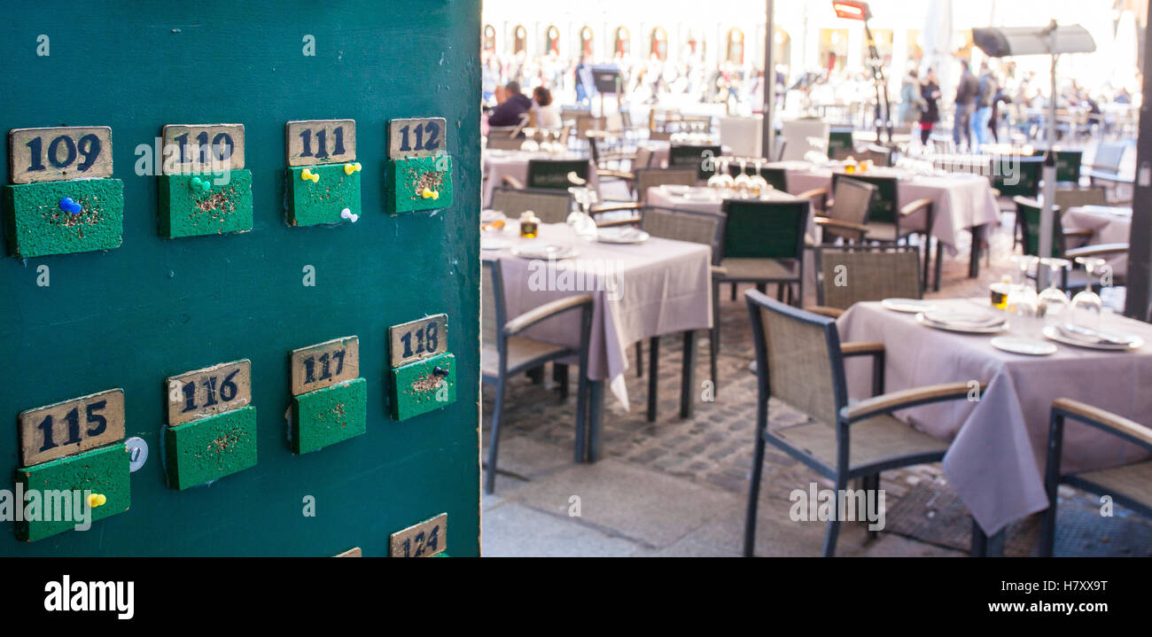 Green tabloid for tables orders at terrace restaurant, Spain Stock Photo