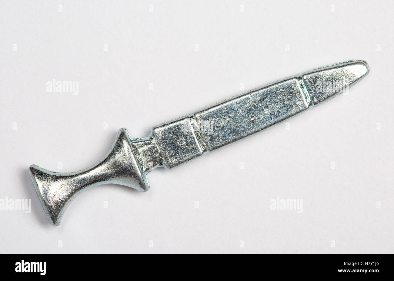 Cluedo board game murder weapon pieces - dagger Stock Photo