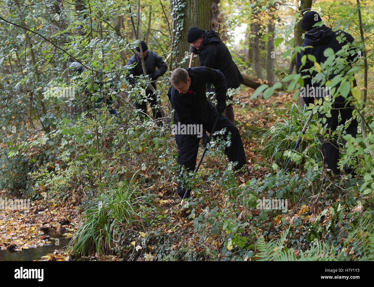 Police officers search an area of Coombe Country Park in Coventry after receiving new witness information relating to the disappearance of Nicola Payne. Stock Photo
