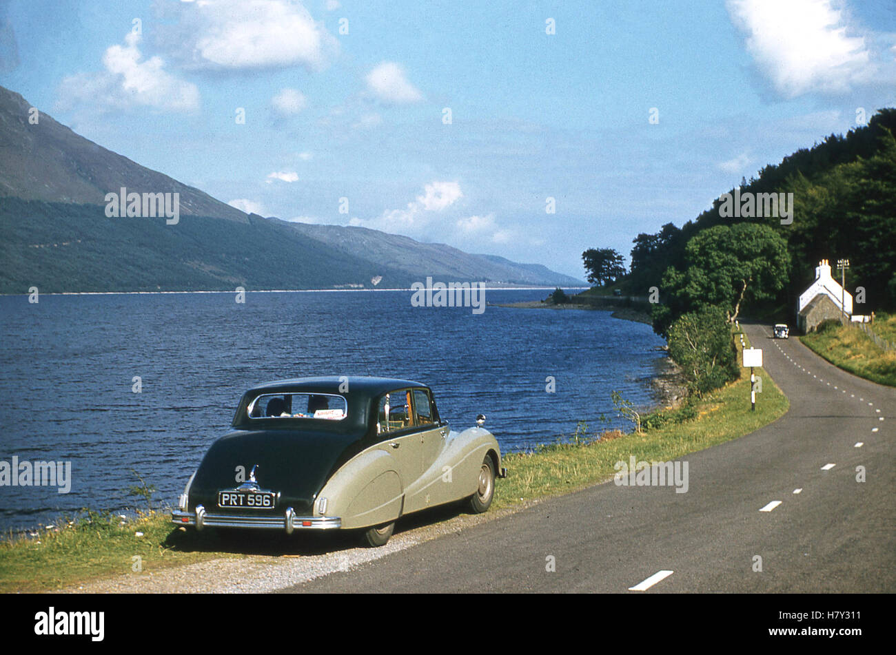 1950s, historical, Touring the lakes by car in this era. Luxury Daimler car parked on  roadside verge, England, UK. Stock Photo