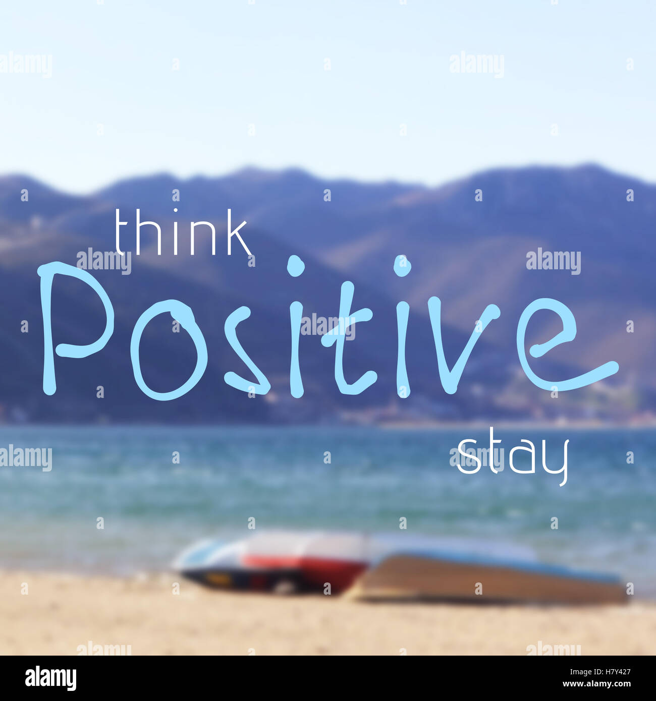 Think and stay positive inspirational quote on blurred background ...