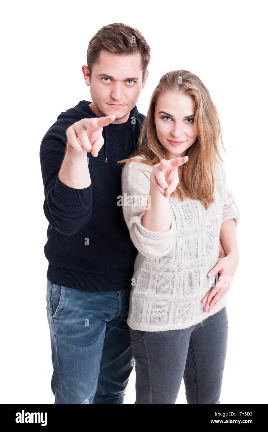 Couple standing showing watching you gesture isolated on white