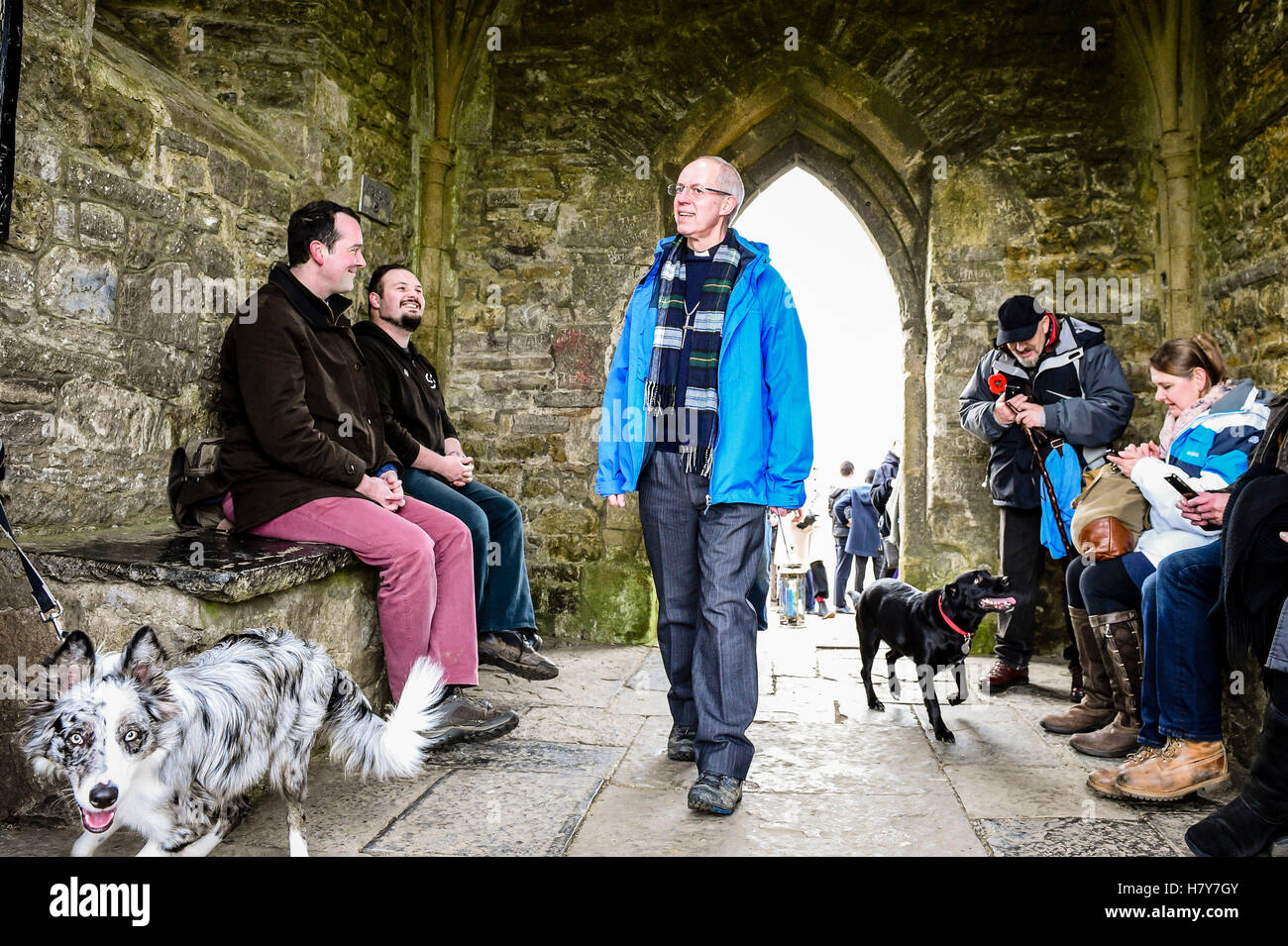 The Archbishop of Canterbury, the Most Rev Justin Welby inspects the interior of St Michael's Tower atop Glastonbury Tor accompanied by local clergy, parishoners and people of other faith and spiritual groups during his visit to the Somerset area. Stock Photo