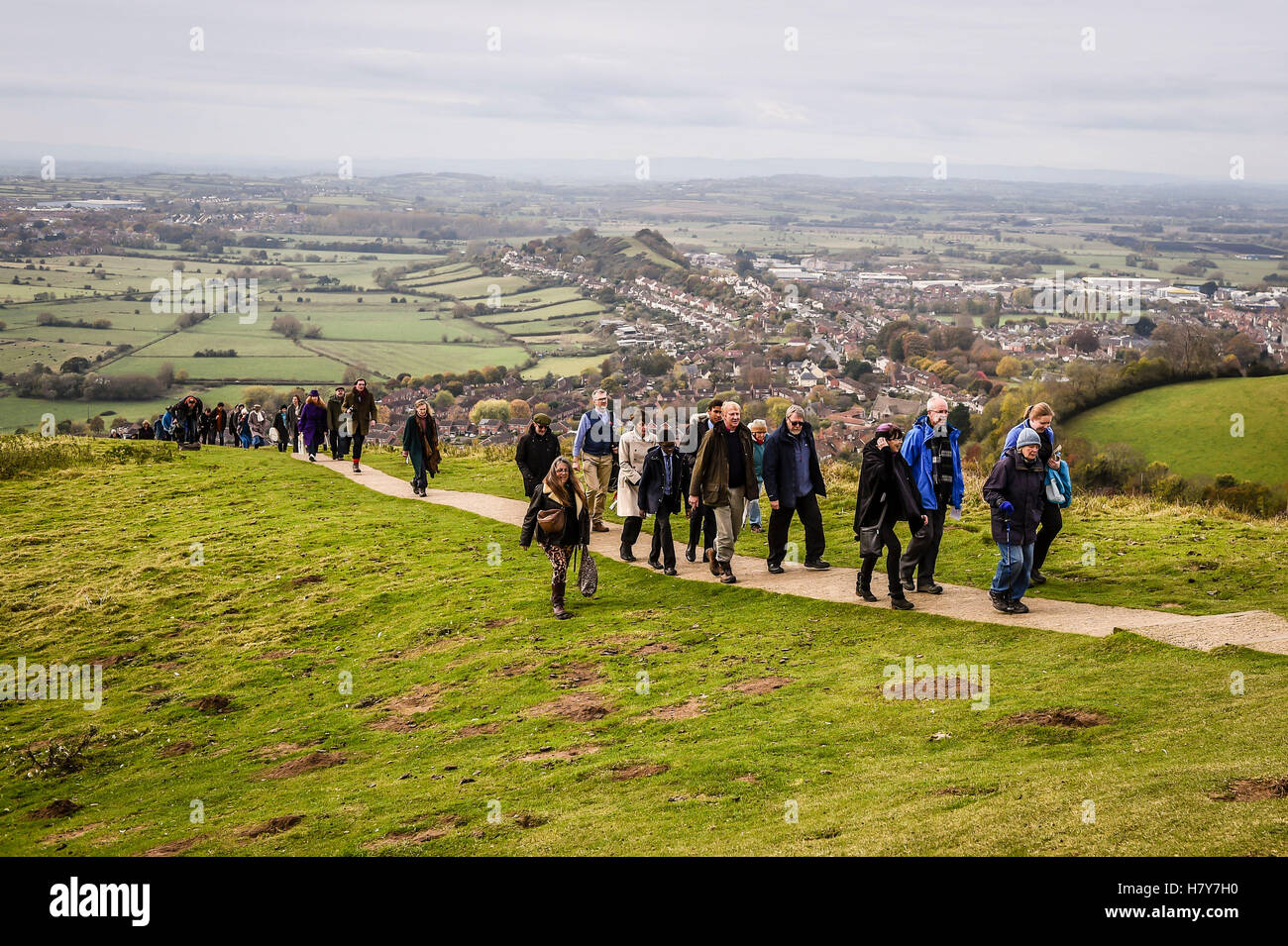 The Archbishop of Canterbury, the Most Rev Justin Welby ascends the 301 steps to the top of Glastonbury Tor accompanied by local clergy, parishoners and people of other faith and spiritual groups during his visit to the Somerset area. Stock Photo