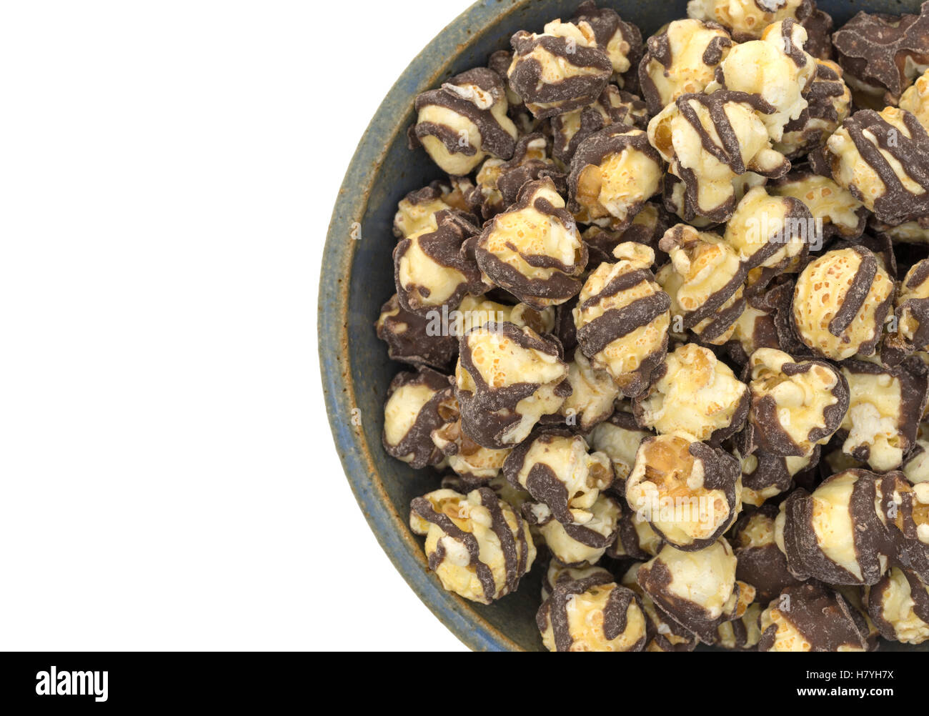 Top close view of a serving of fudge drizzled popcorn in an old ...
