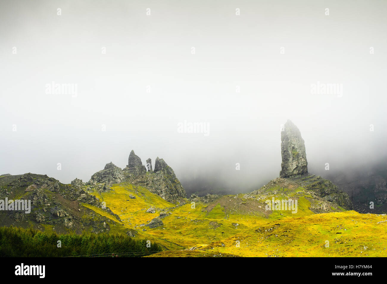 The old man of Storr rock in the fog on Isle of Skye mountains. Scotland, Uk, Europe Stock Photo