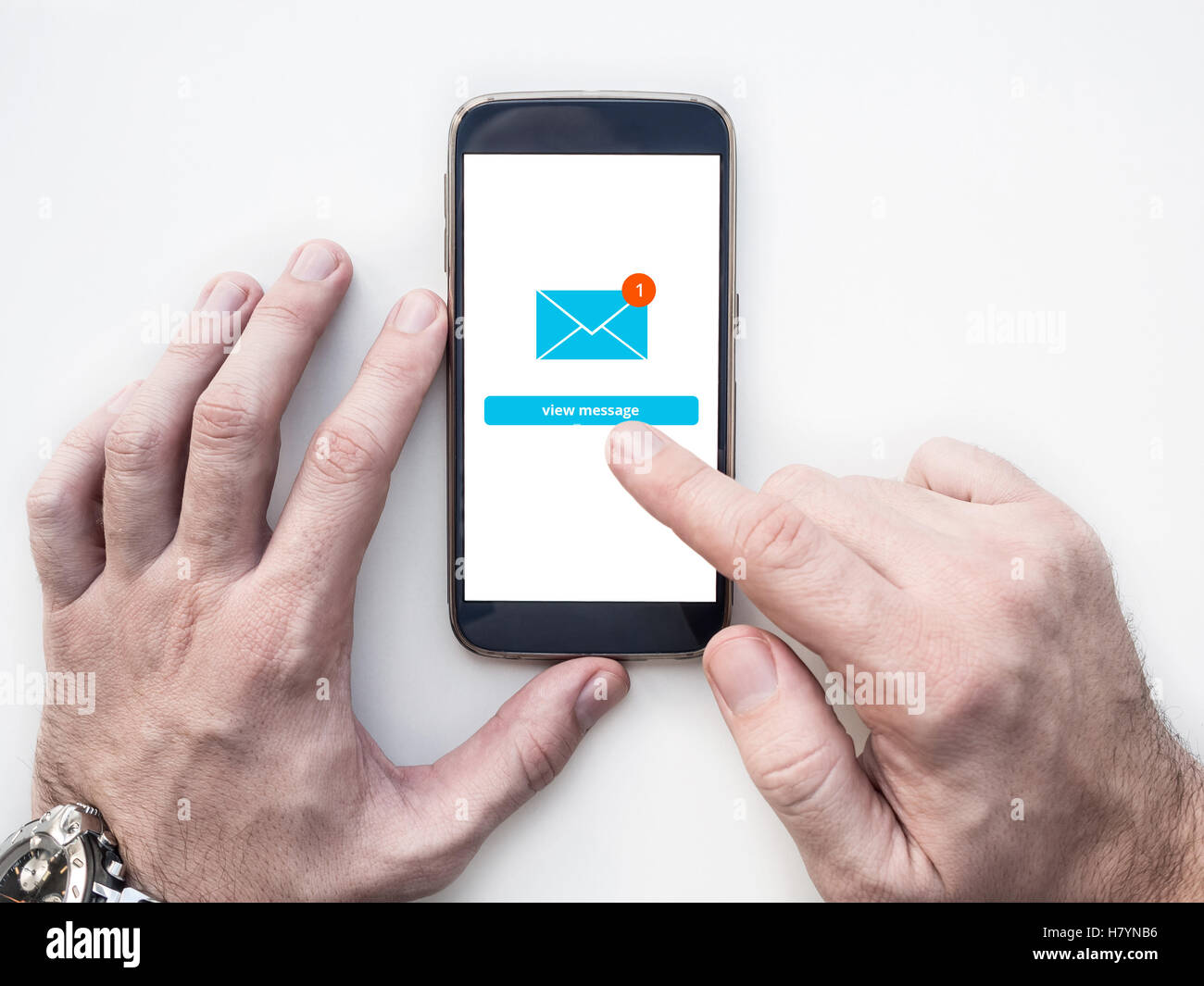 Man's hands using smartphone with Email app interface on screen Stock Photo