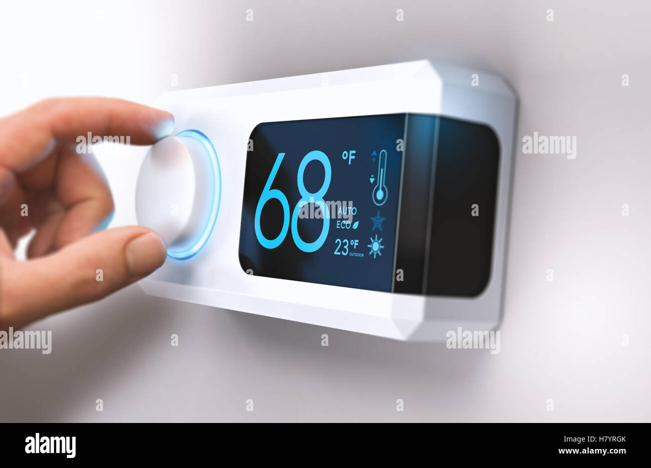 Hand turning a home thermostat knob to set temperature on energy saving mode. fahrenheit units. Composite image between a photog Stock Photo