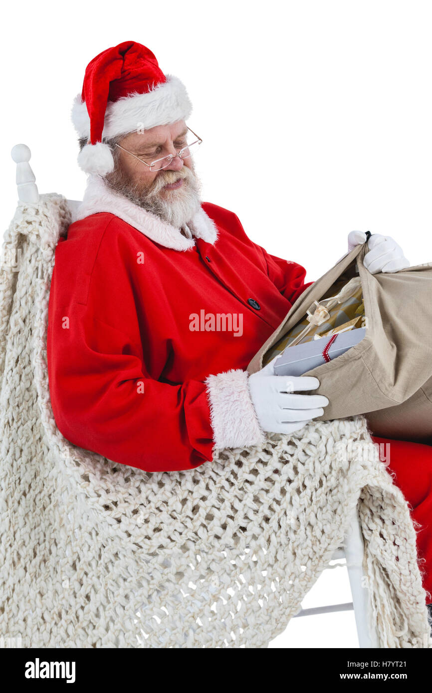 Santa sitting on chair hi-res stock photography and images - Alamy