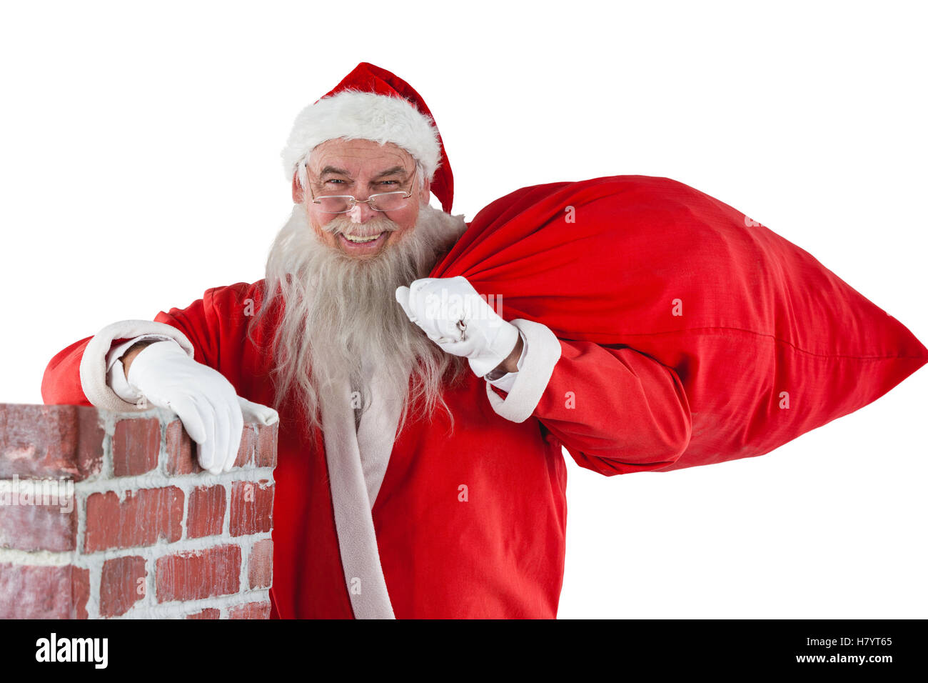 Portrait of santa claus carrying bag full of gifts Stock Photo - Alamy