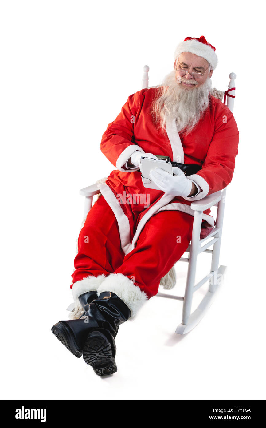 Santa claus using digital tablet Stock Photo - Alamy