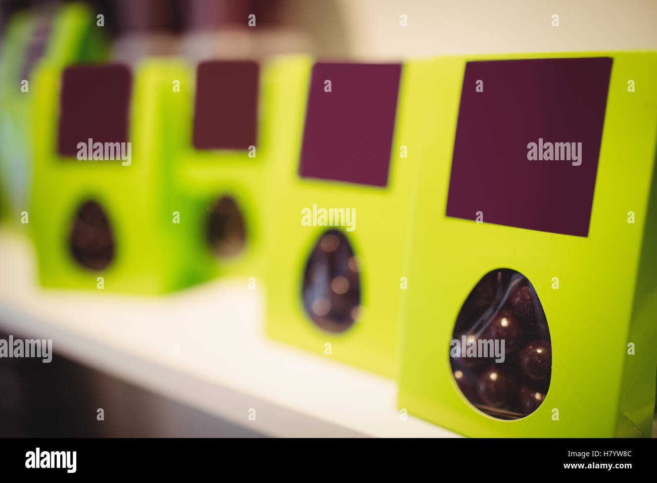 Packed chocolates in green box in display Stock Photo