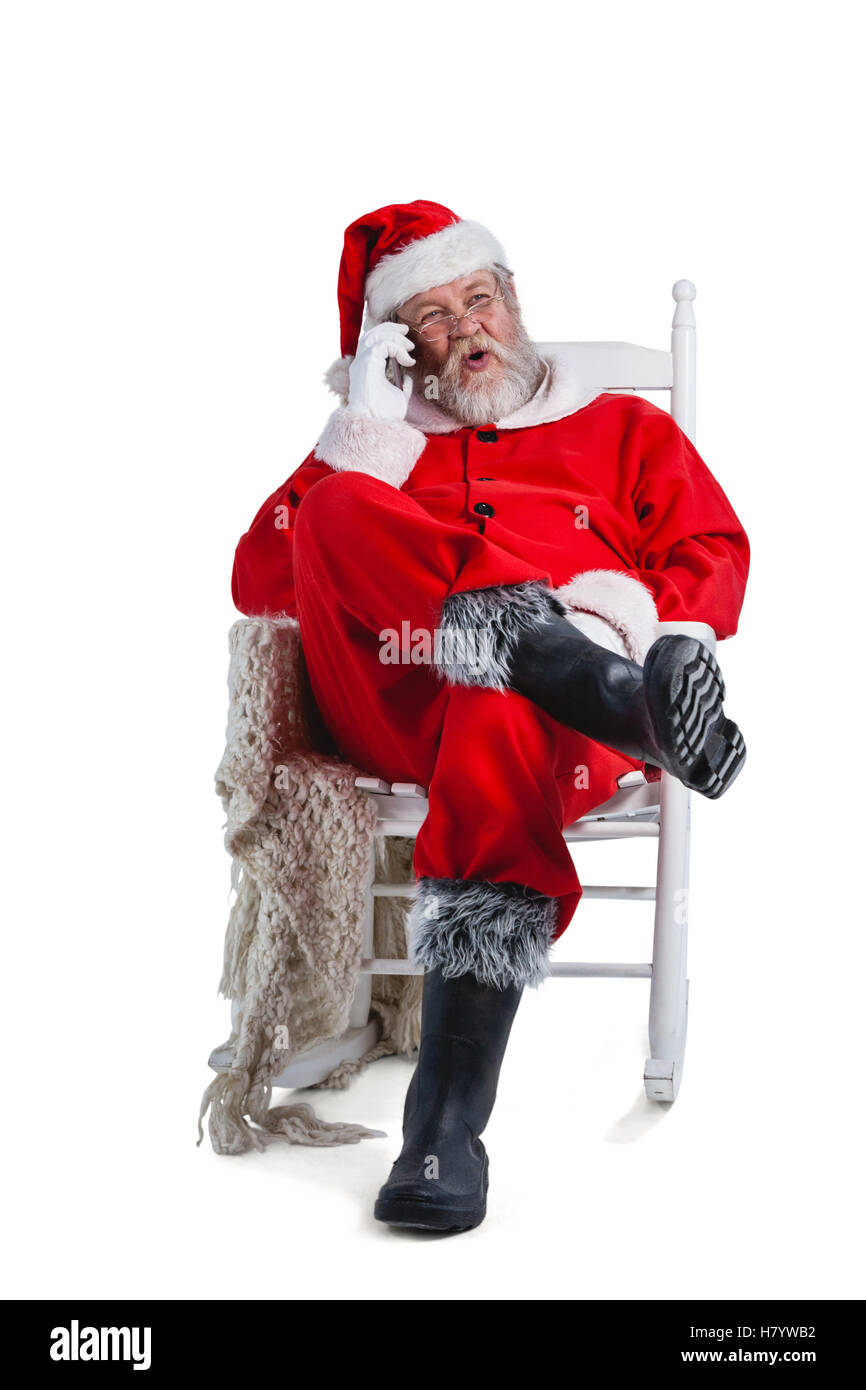 Santa claus talking on mobile phone Stock Photo