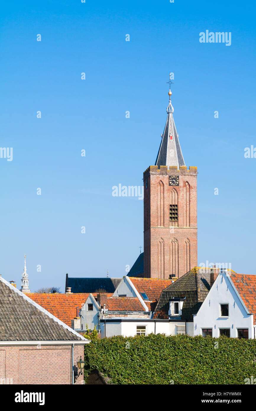 Tower of Big Church or Saint Vitus Church and rooftops of houses in old town of Naarden, North Holland, Netherlands Stock Photo