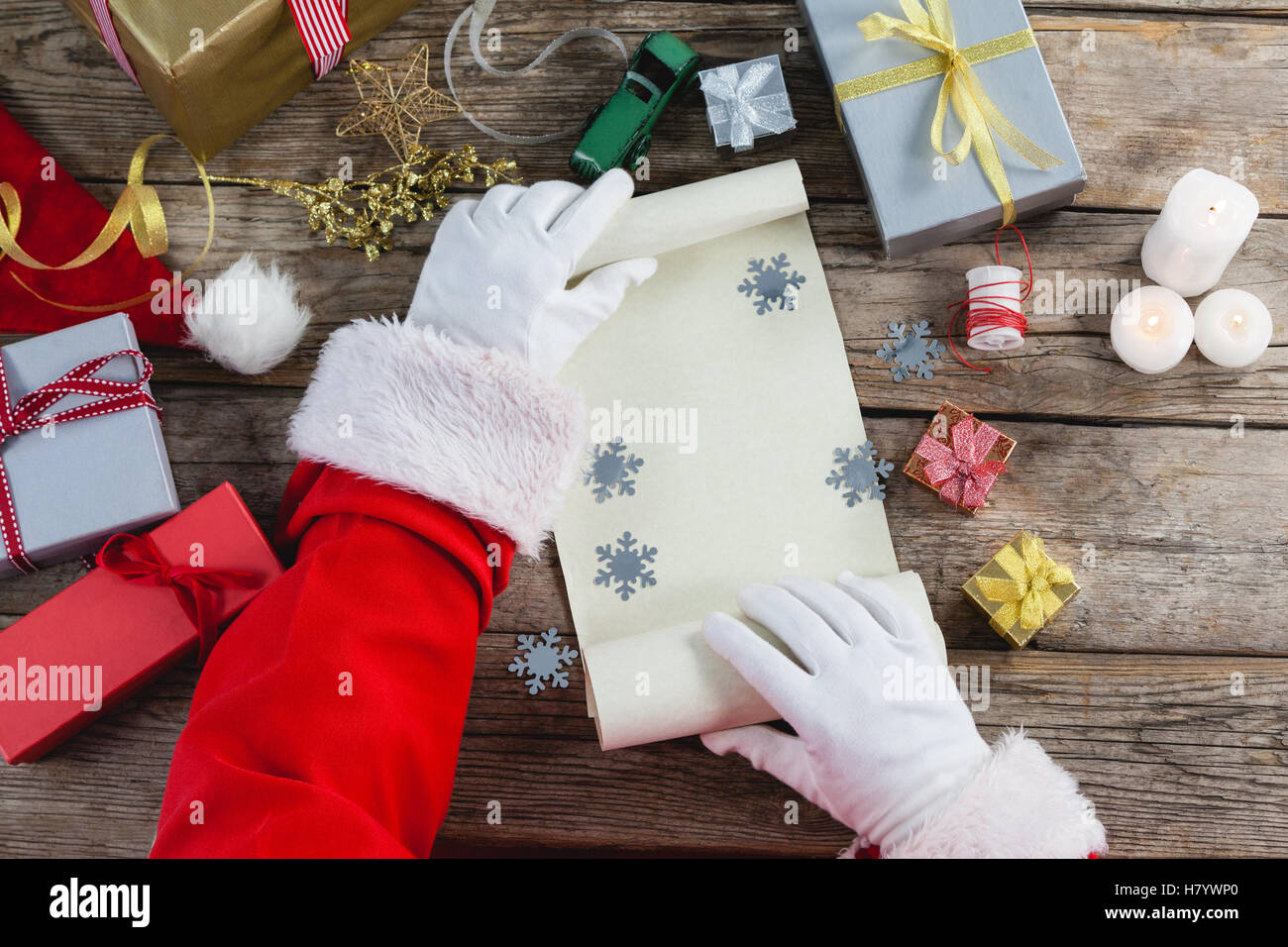 Santa Claus holding blank paper scroll Stock Photo - Alamy