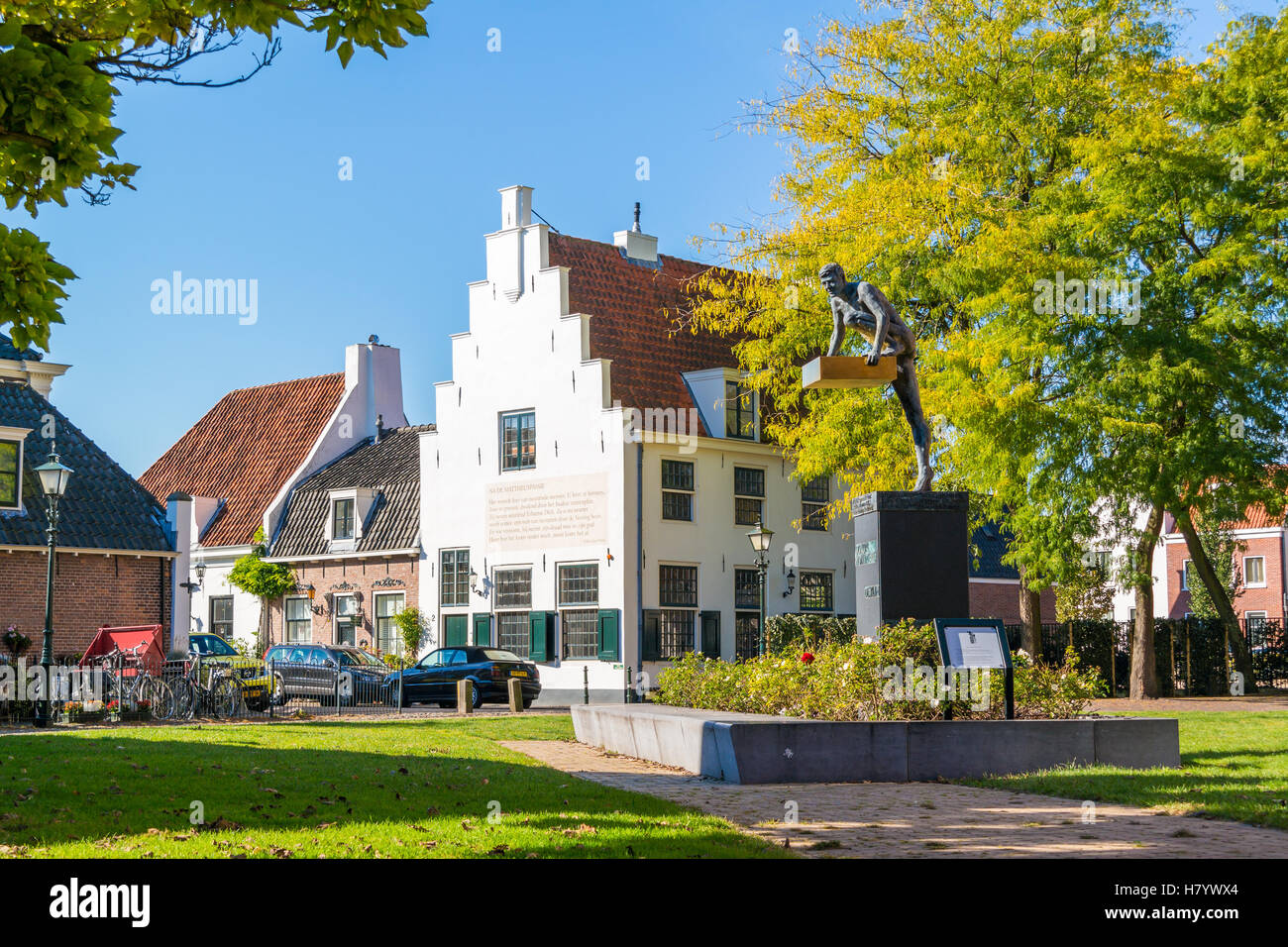 Street scene with donor memorial monument and house with stepped gable in old town of Naarden, North Holland, Netherlands Stock Photo
