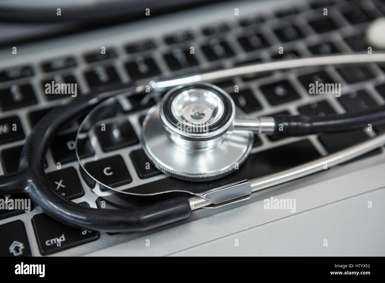 Stethoscope on laptop Stock Photo - Alamy