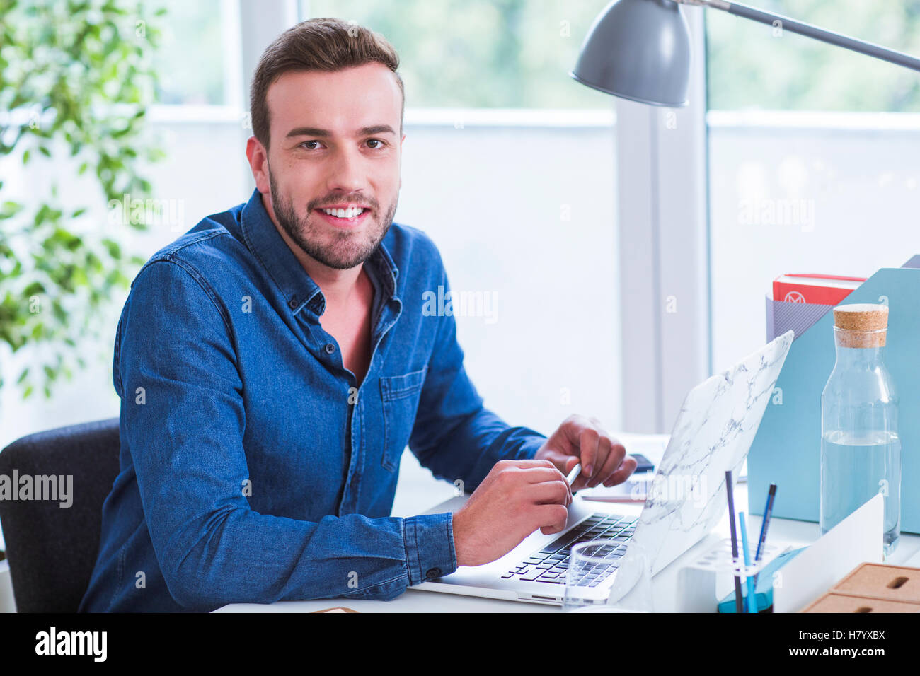 Man working in office Stock Photo - Alamy