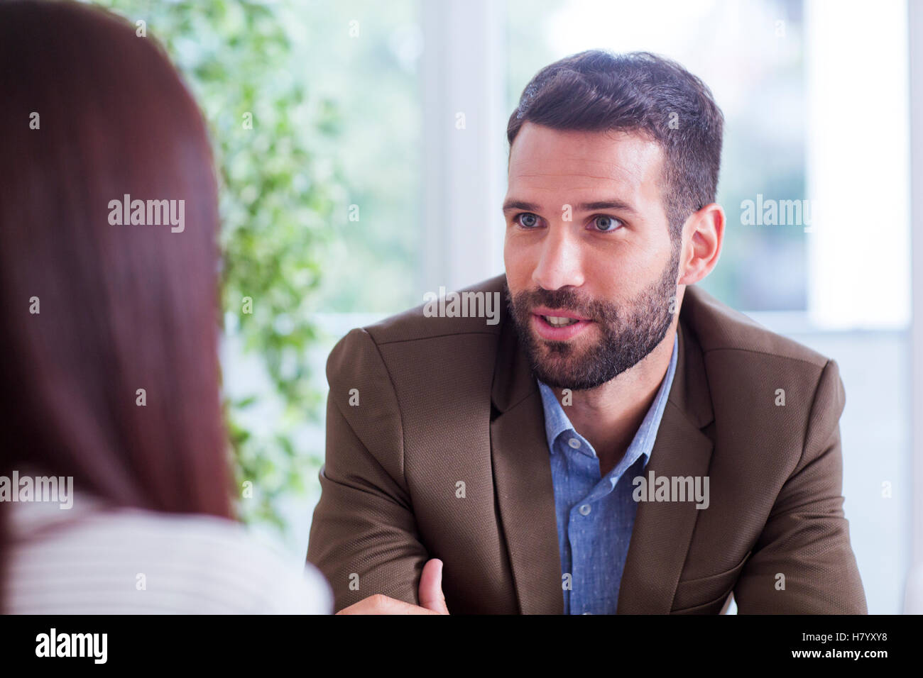 Man and Woman working in office Stock Photo