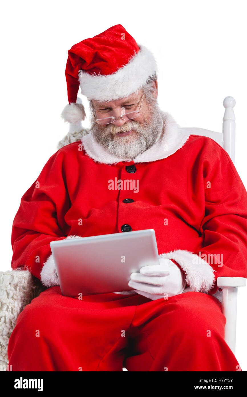 Santa claus using digital tablet Stock Photo - Alamy