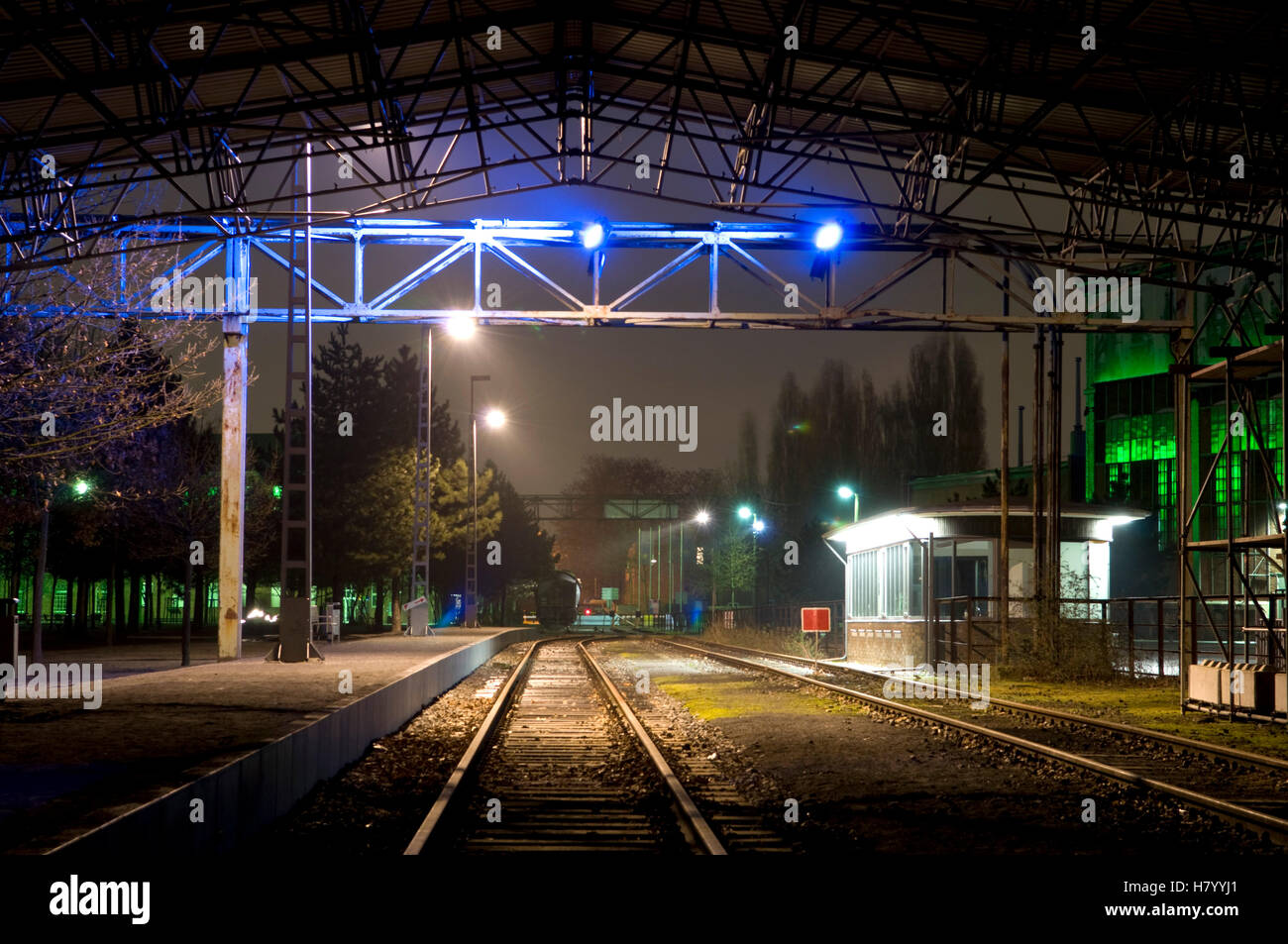Illuminated train station in the former smelting works in the Landschaftspark Duisburg Nord landscape park, Ruhrgebiet area Stock Photo