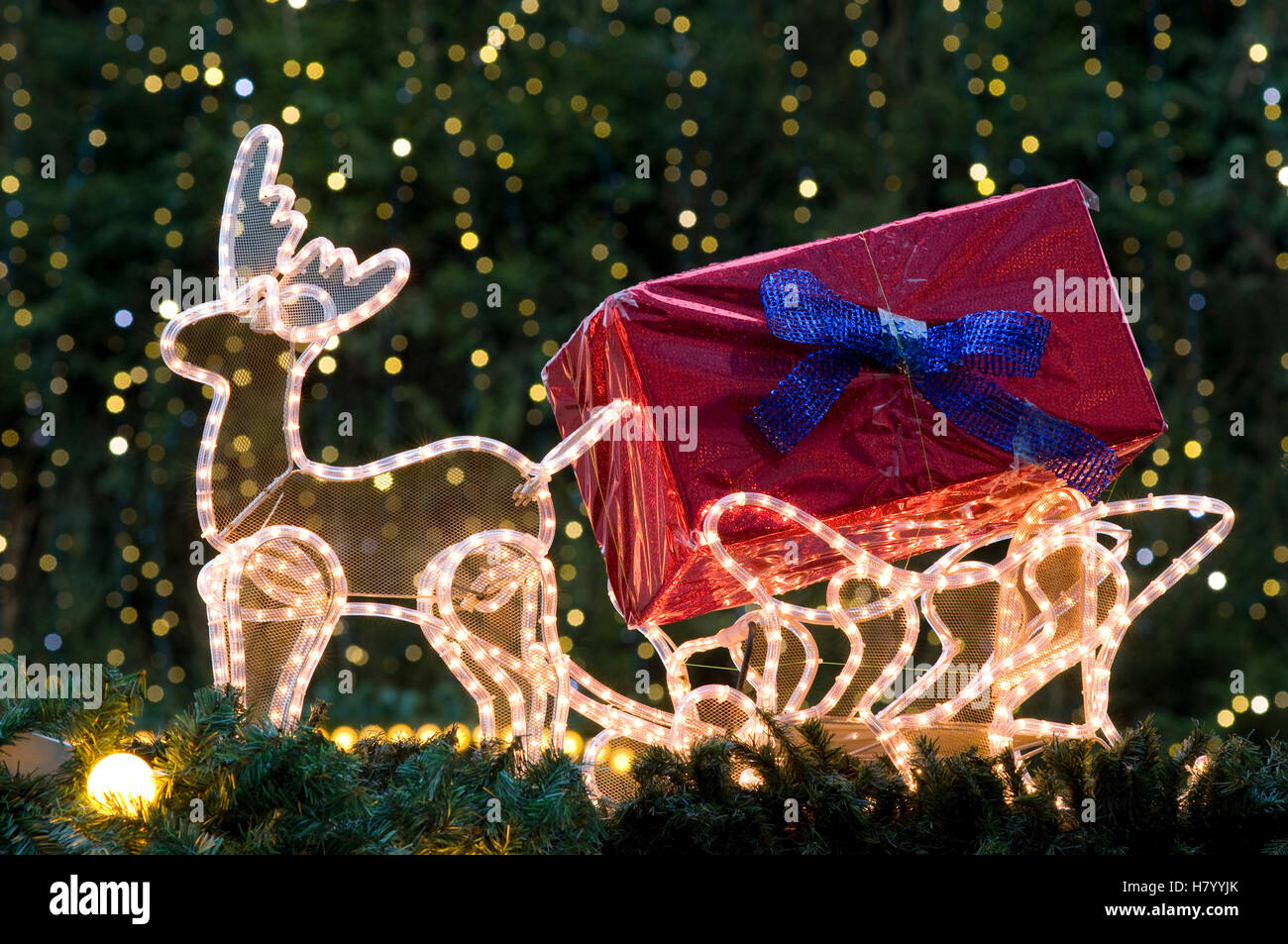 Illuminated reindeer sleigh on a Christmas market stall Stock Photo