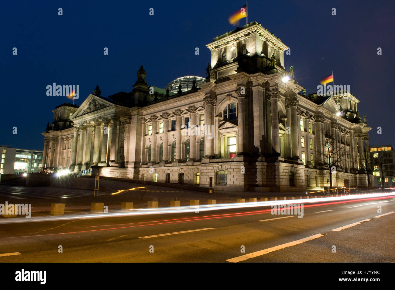 Light trails in front of the Reichstag parliament, Berlin Stock Photo