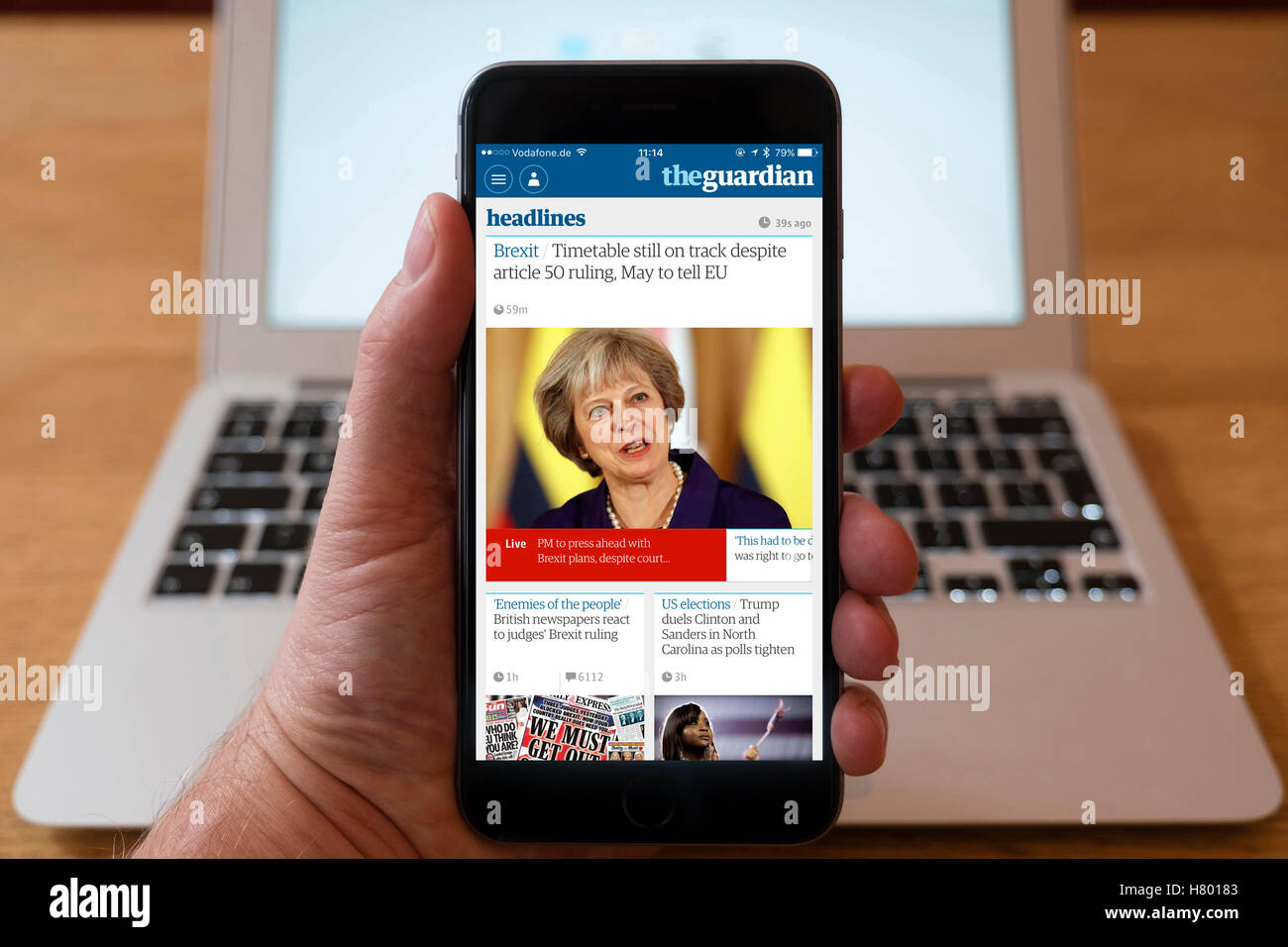 Using smarphone to display headlines from The Guardian UK newspaper Stock Photo