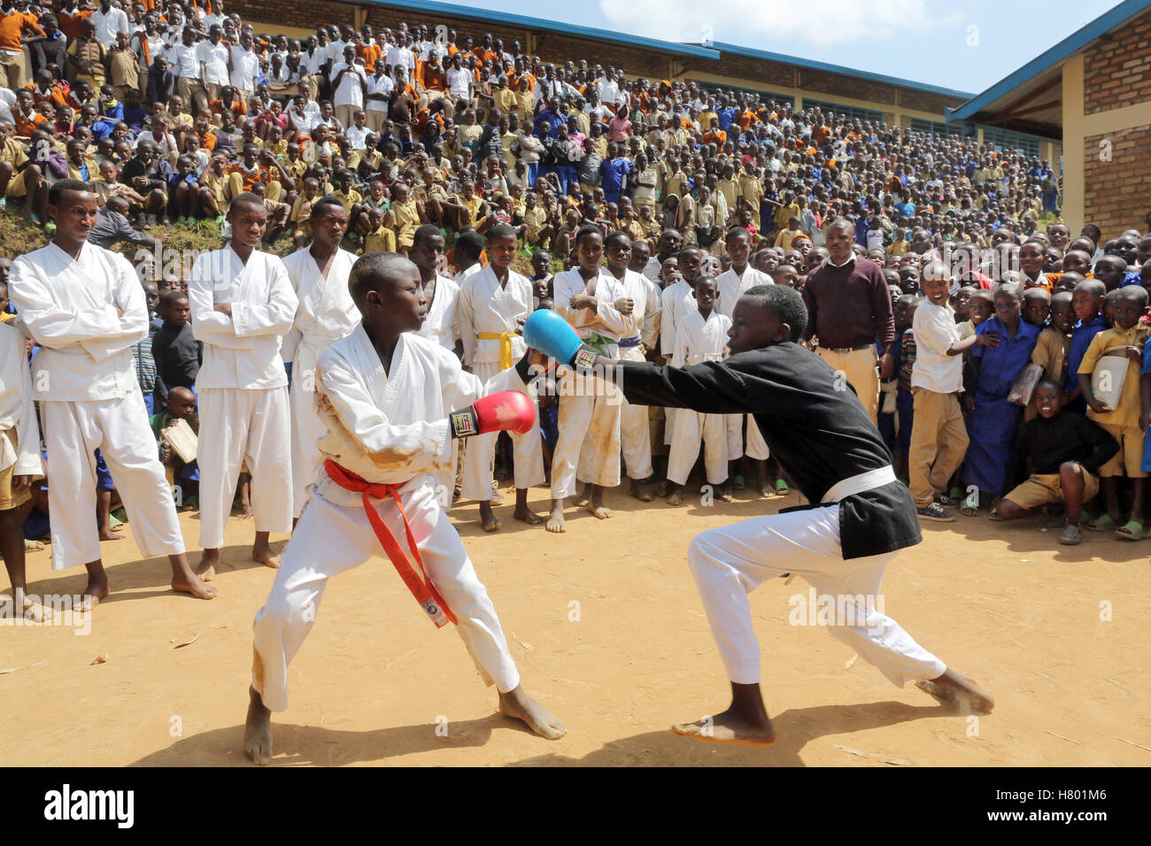 Boxing performances of refugee children from the Congo in front of the school in the UNHCR Kigeme refugee camp. Diocese of Gikongoro, Rwanda, Africa Stock Photo