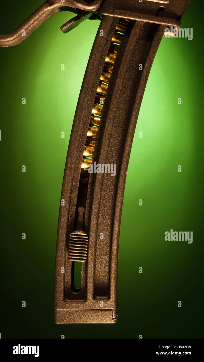 High capacity assault rifle magazine with green color behind Stock Photo Alamy
