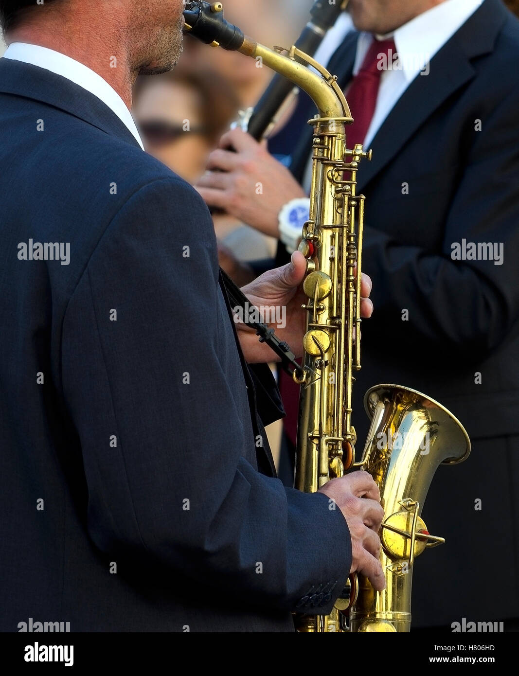 Detail of a musician plays the saxophone reading the score (shallow focus). Stock Photo