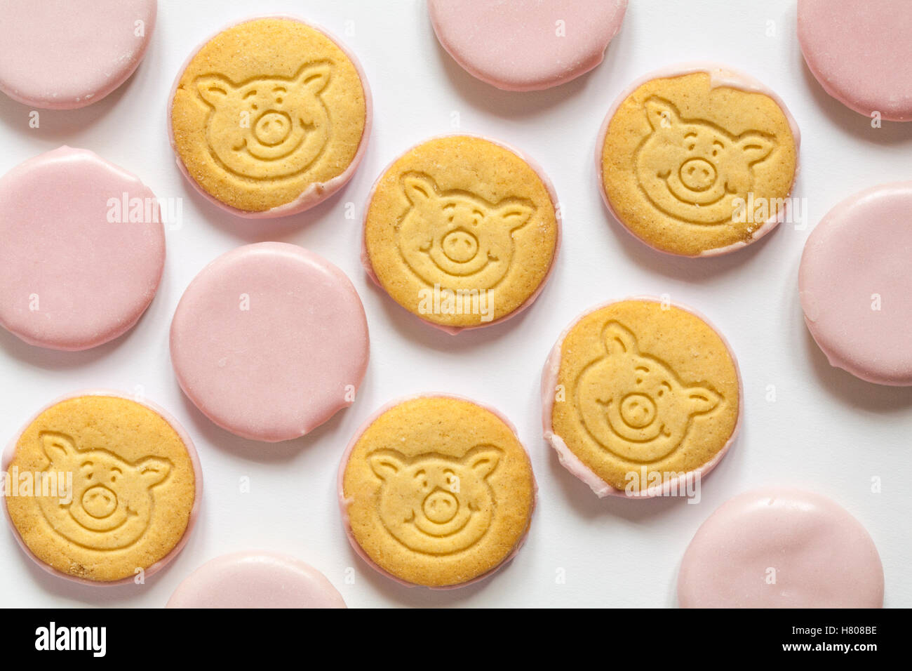 M&S percy pig mini all butter biscuits decorated with raspberry flavour icing set on white background Stock Photo