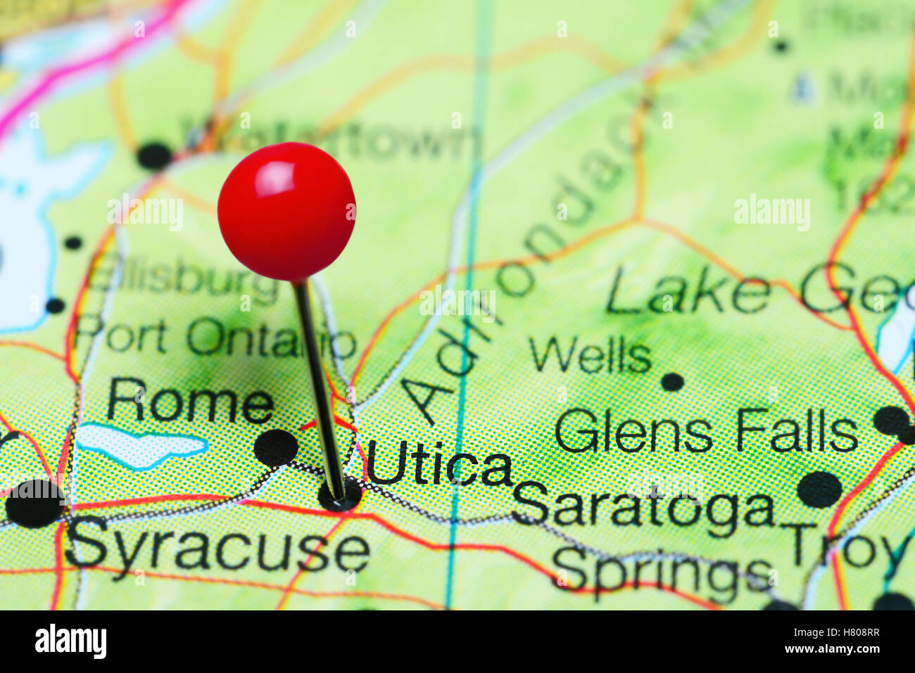 Utica pinned on a map of New York state, USA Stock Photo