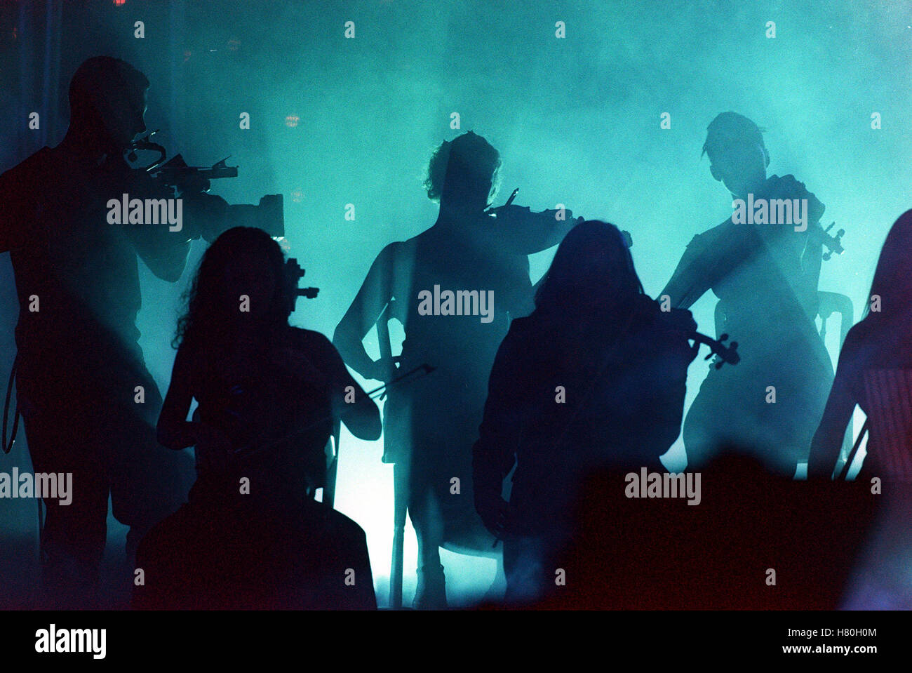 SILHOUETTED VIOLIN PLAYERS  15 November 1999 Stock Photo