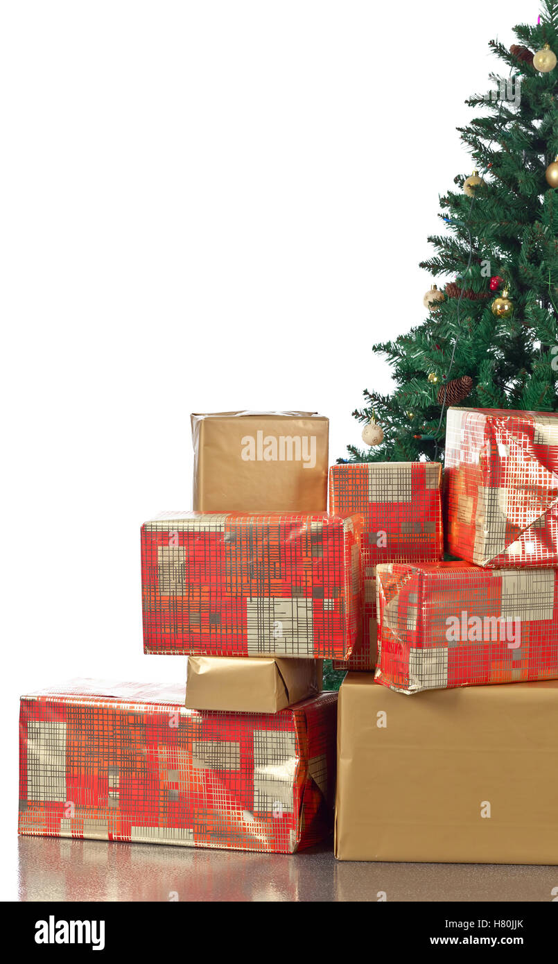 Christmas tree with gifts in colourful boxes , isolated on white ...