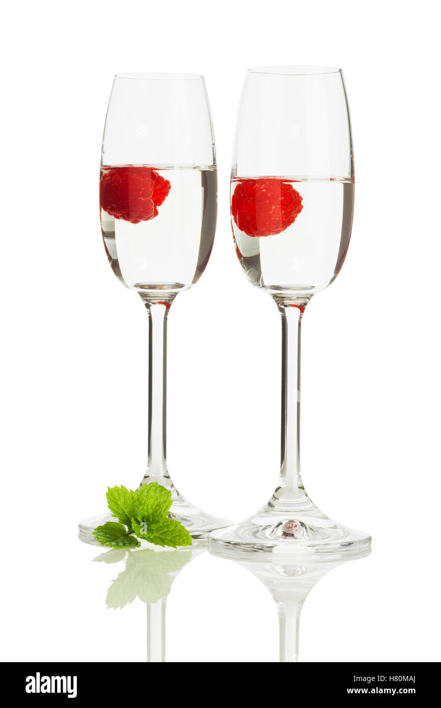 Two glasses of raspberry spirit isolated on white background Stock ...