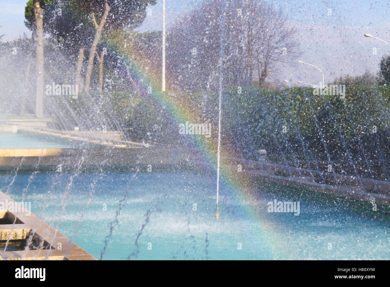 Rainbow effect on waterdrops fountain Stock Photo