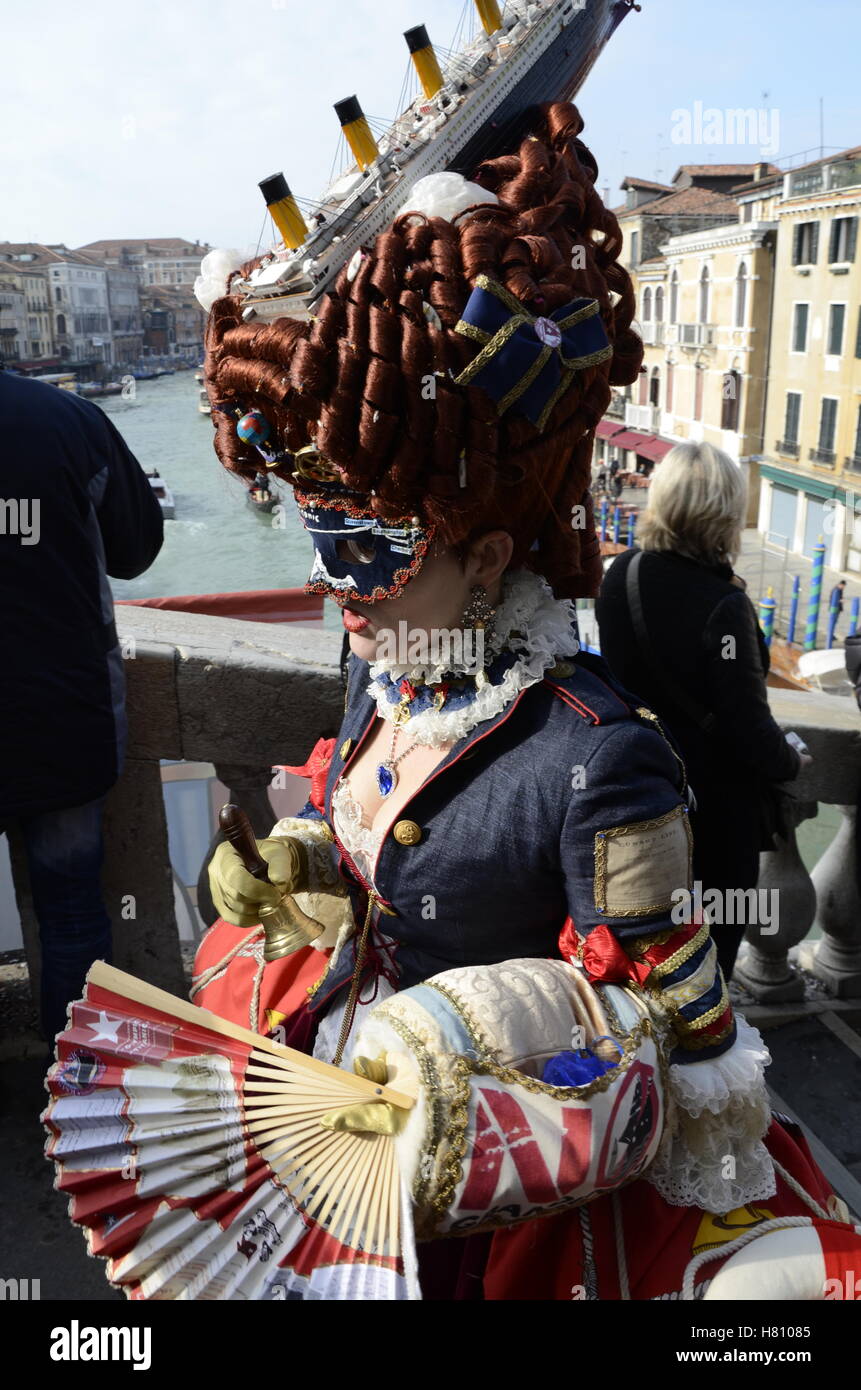 Woman with Titanic head dress on Rialto Bridge Venice Stock Photo