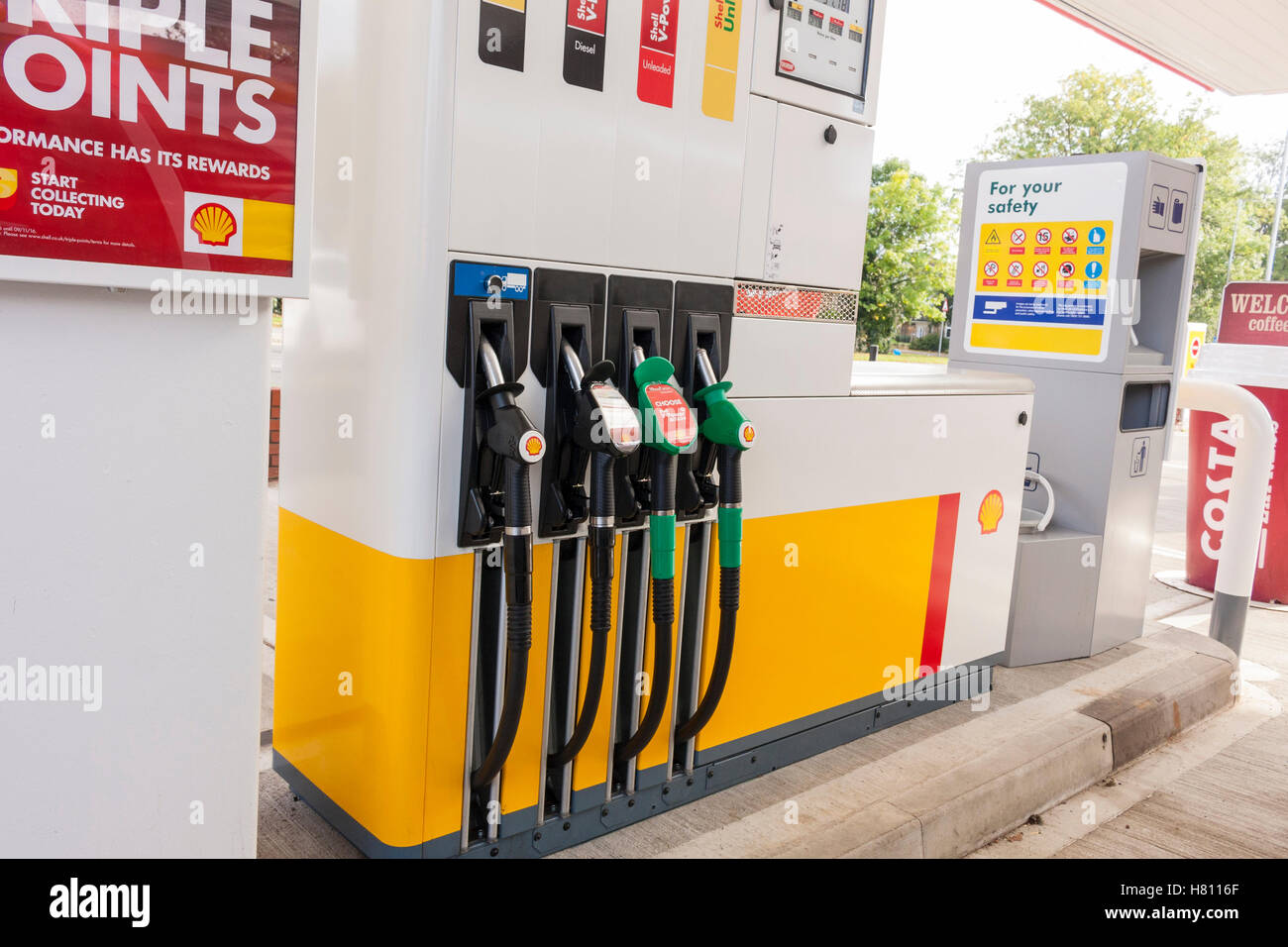 Petrol pump with the various fuel types at the Shell petrol station in Ickenham, Hillingdon, Greater London, UK Stock Photo