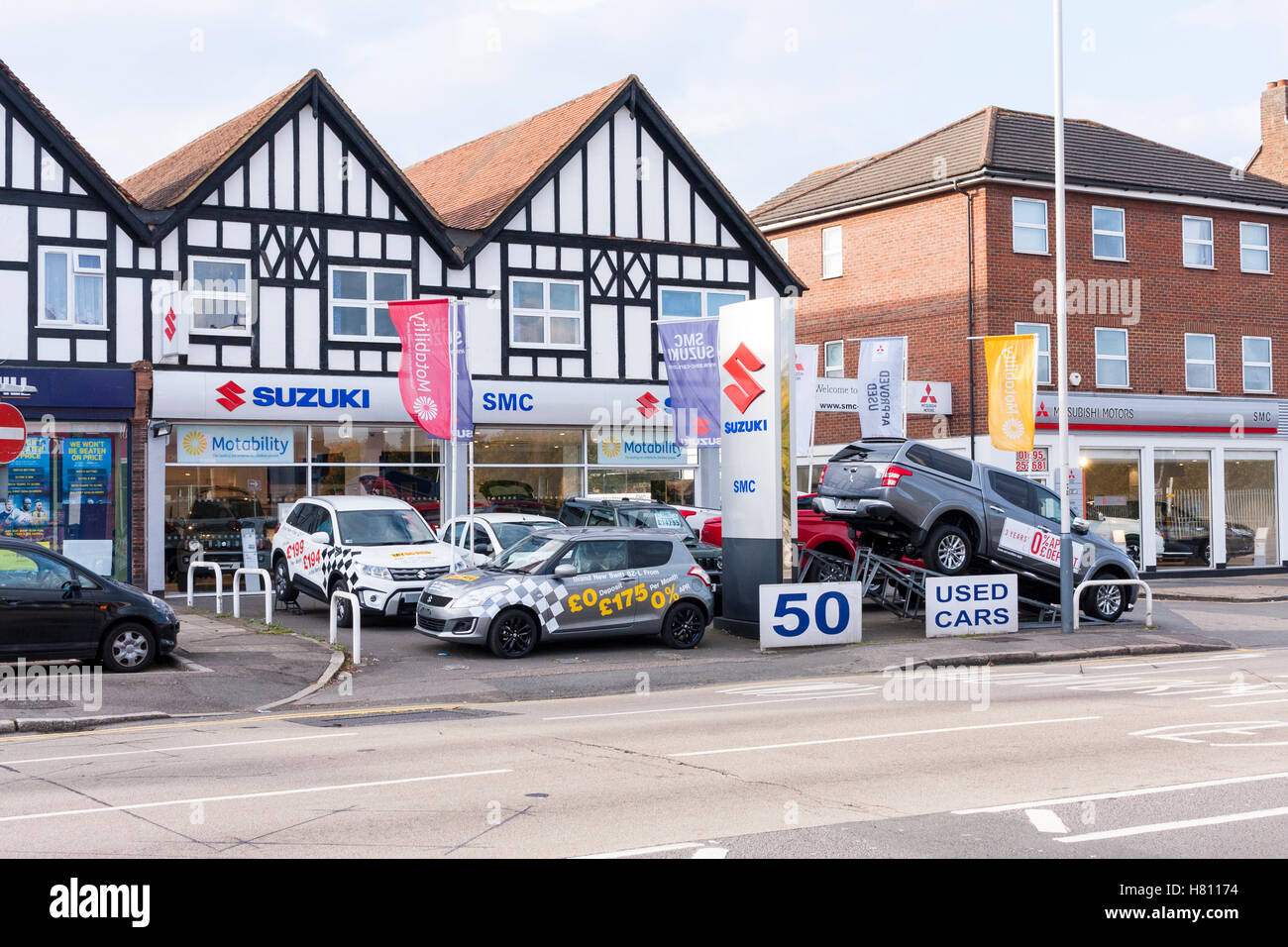 View of Suzuki Garage exterior and forecourt, Hillingdon Circus, Hillingdon, Greater London, UK Stock Photo