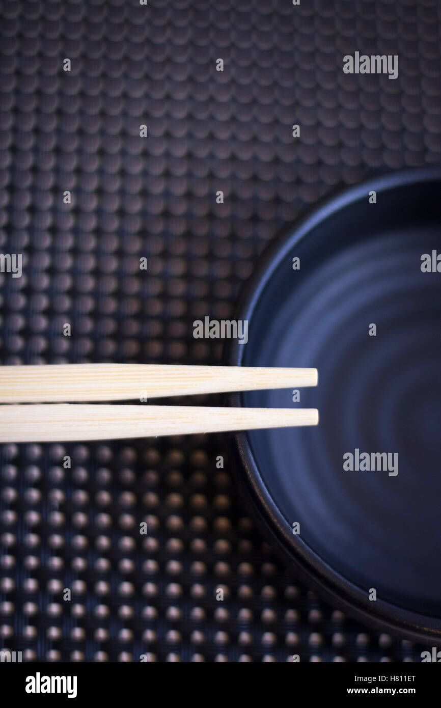 Asian chopsticks in Japanese restaurant to eat sushi and oriental