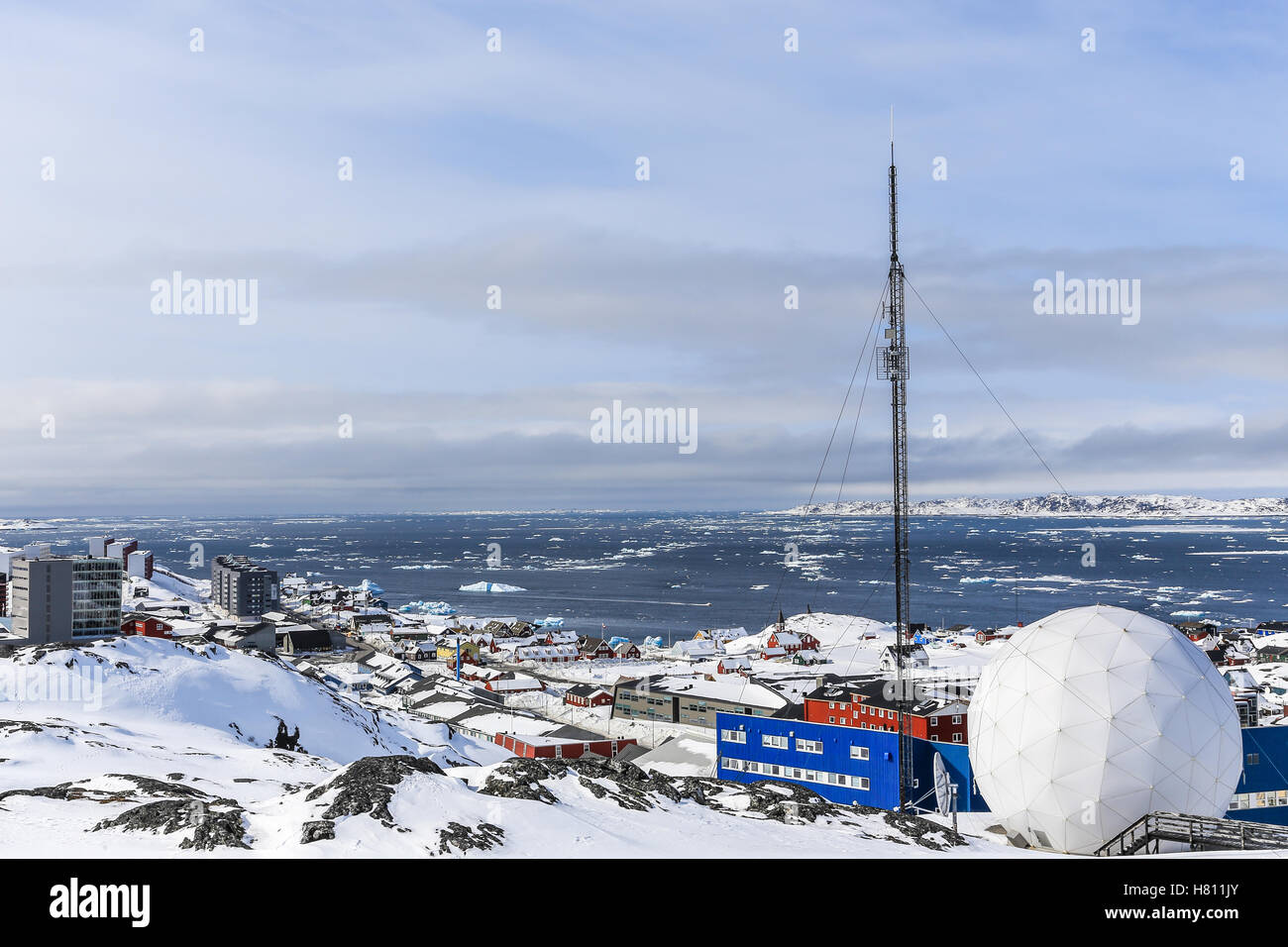 Snow covered city and fjord with icebergs overview, Nuuk, Greenland Stock Photo